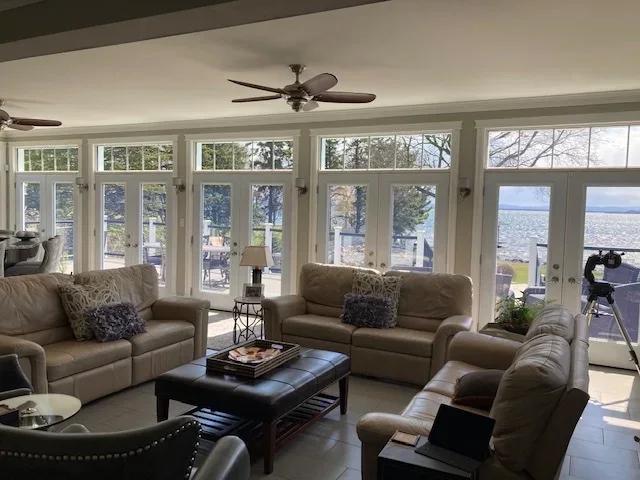 KV custom wood windows in a lakeside sunroom